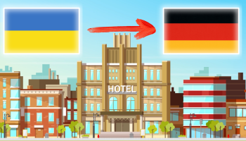 Український прапор, червона стріла, німецький прапор, готель на задньому плані