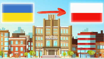 Український прапор, червона стрілка, польський прапор, на задньому плані можна побачити графіку з готелем